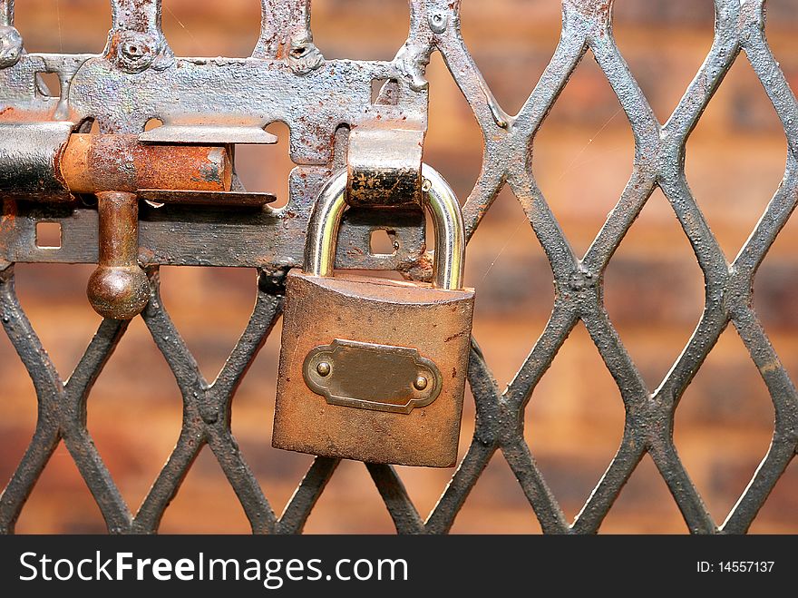 An old rusty latch and padlock