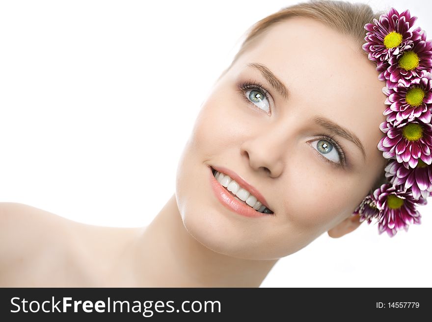 Beauty woman closeup face with flowers on white background