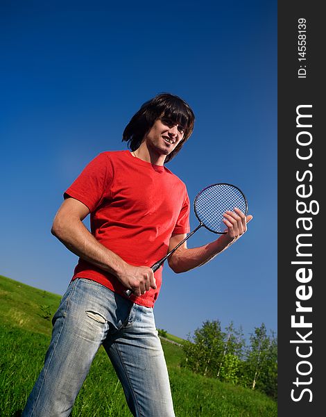 Boy in red t-shirt with smile and with racket. Boy in red t-shirt with smile and with racket