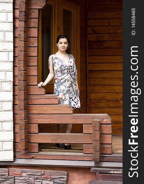 Girl standing on a veranda. Girl standing on a veranda