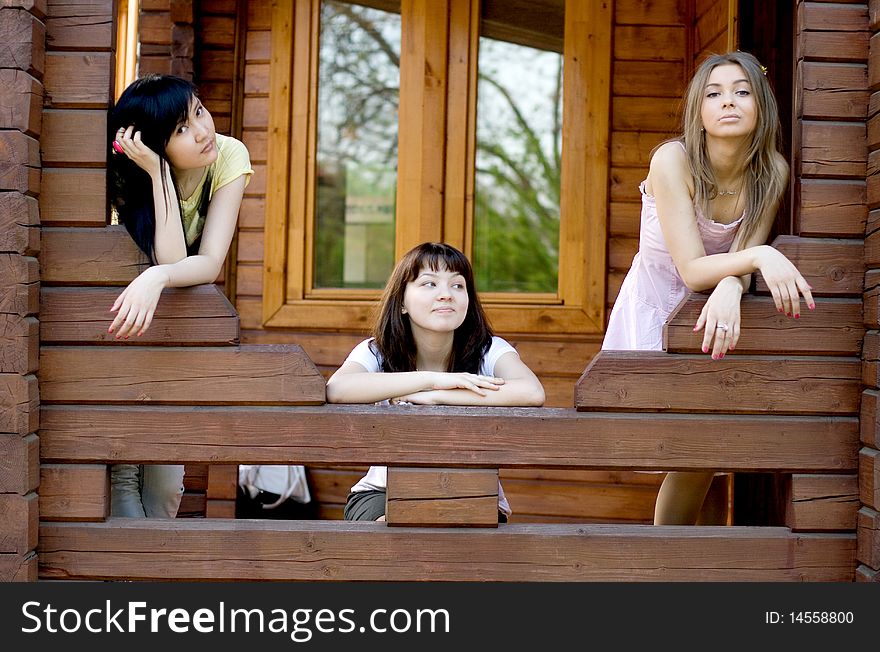 Three female friends on a veranda