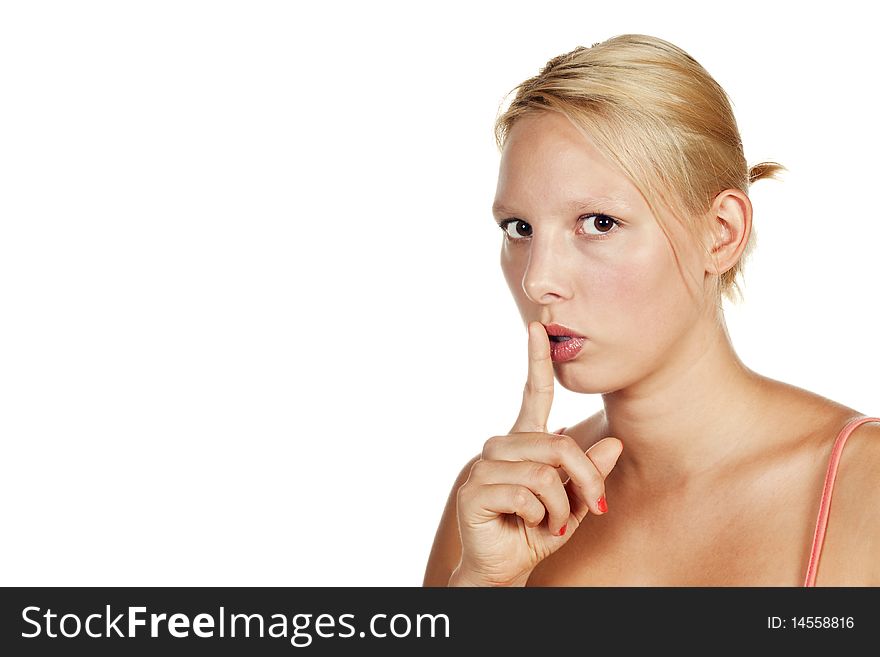 Portrait of an attractive young blonde girl hushing. Isolated over white. Portrait of an attractive young blonde girl hushing. Isolated over white.