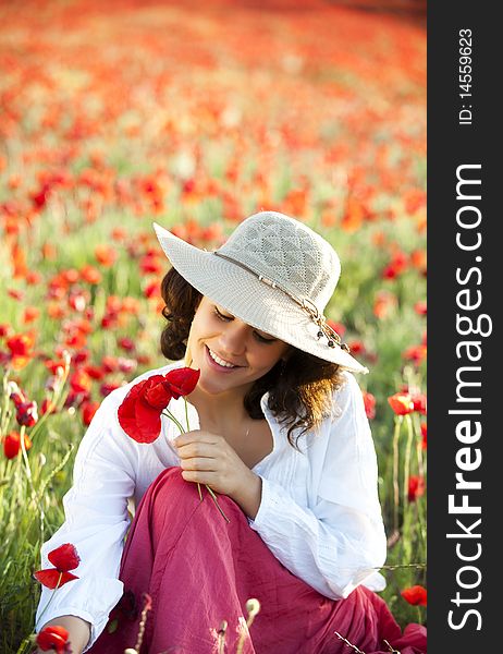 Young beautiful woman in spring field. Young beautiful woman in spring field