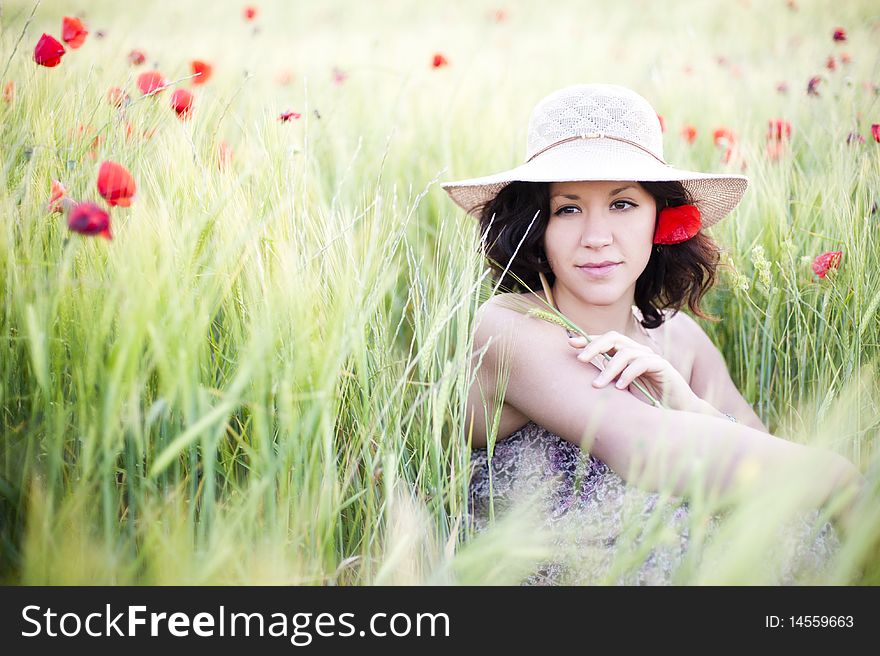 Young beautiful woman in spring field. Young beautiful woman in spring field