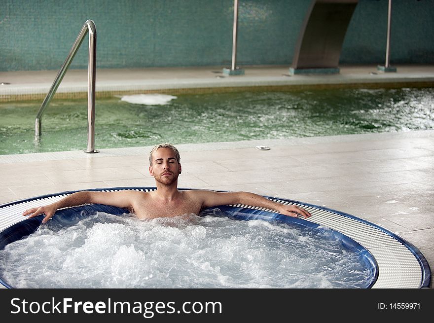 Handsome man in jacuzzi