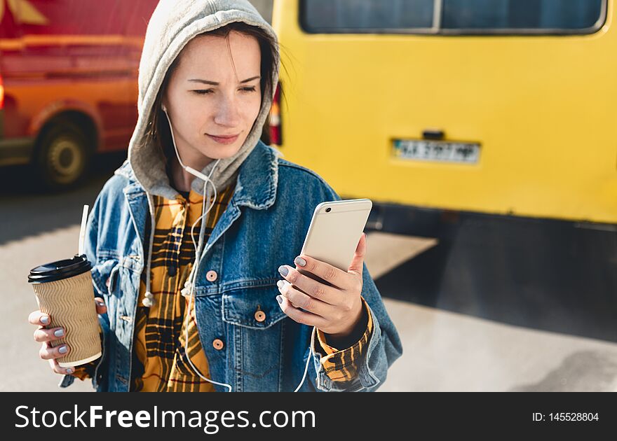 Young vlogger streaming live video live walking down city street