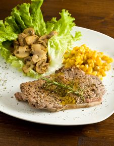 Steak With Mushrooms And Mais Stock Image
