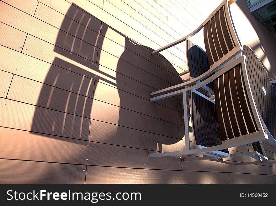 Lounge chairs at sunset on a resorts  deck .