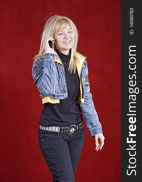 Blond teenage girl talking on the cell phone