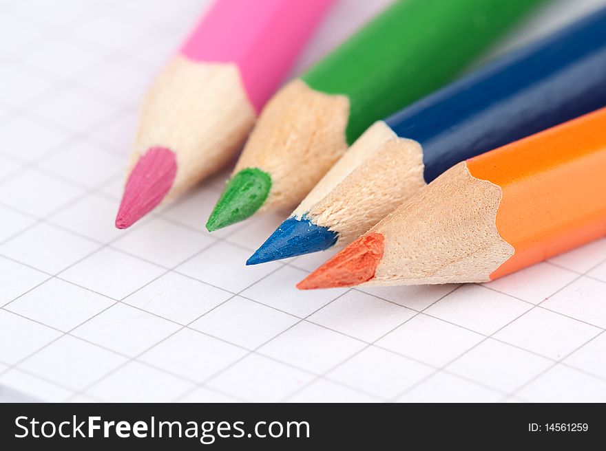 Four colorful pencils close up