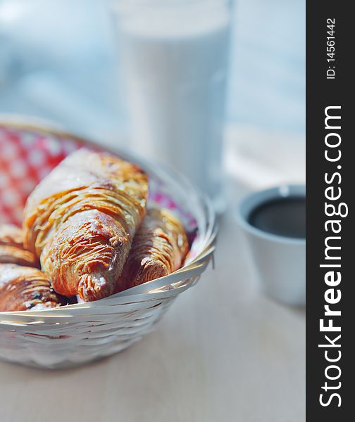 Close up with croissants on a wooden basket
