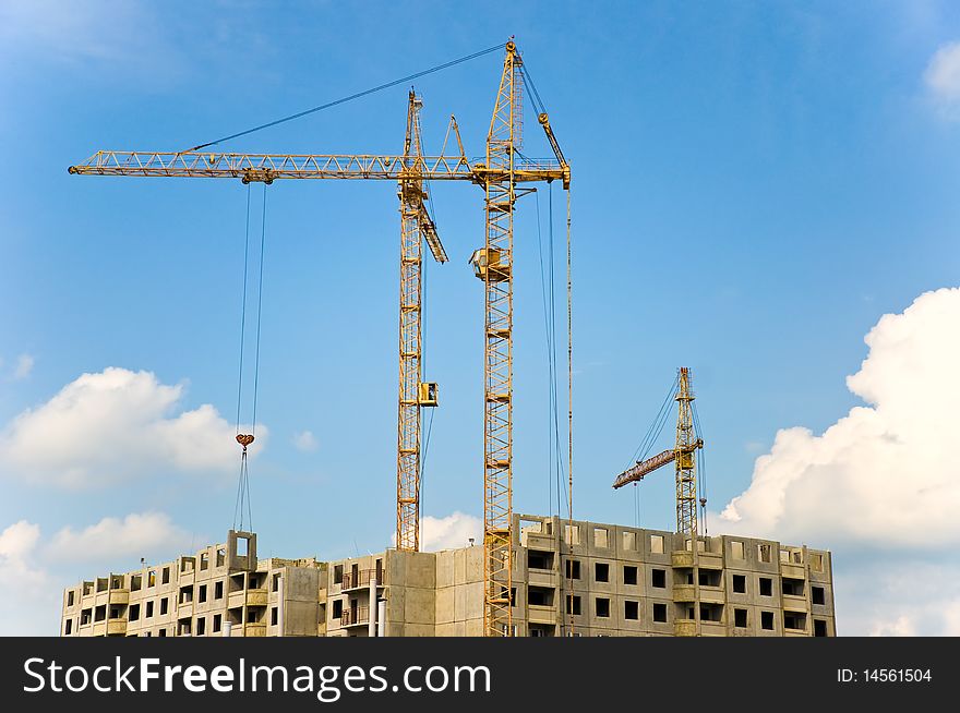 The crane elevating against the sky