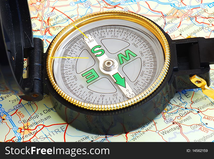 Compass on a map for travel by close up