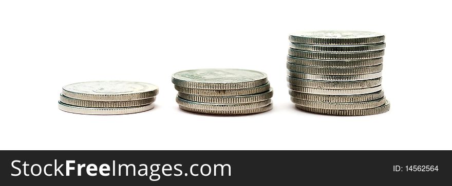 3 stacks of coins arranged from shortest to highest