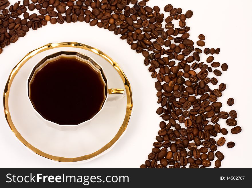 Cup of delicious coffee on a white background