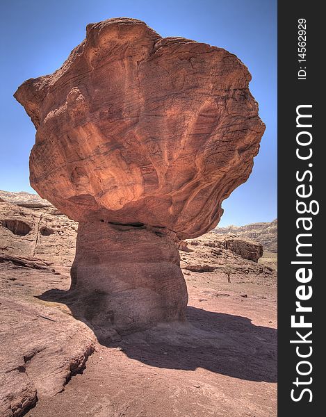 This Mushroom Rock located in Timna Park. The park is located approximately 25 kilometers north of Eilat, in the middle of the Red Sea Desert. This Mushroom Rock located in Timna Park. The park is located approximately 25 kilometers north of Eilat, in the middle of the Red Sea Desert.