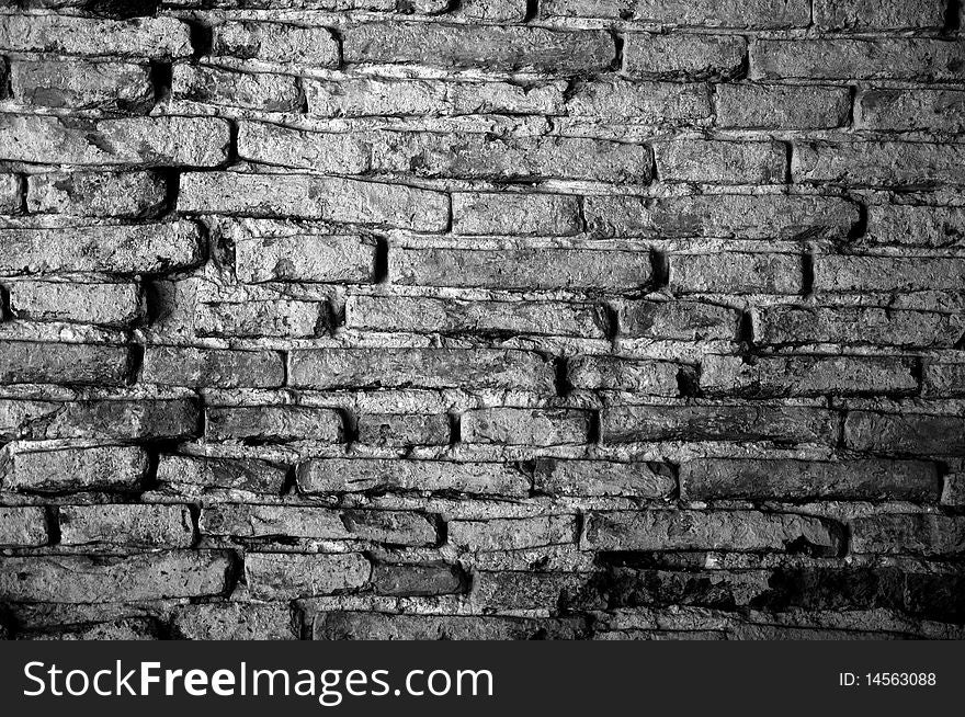 Grunge bricks wall with dramatic lighting. Grunge bricks wall with dramatic lighting