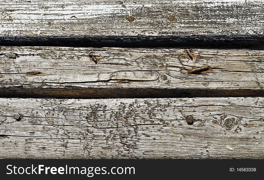 Small part of wooden fence. Old planking. Small part of wooden fence. Old planking