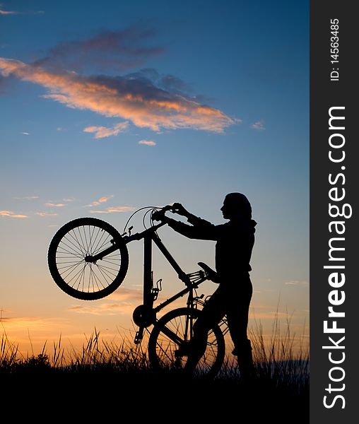 Biker silhouette against the sunset. Biker silhouette against the sunset