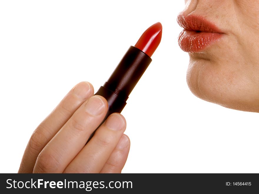 Woman applying a red lipstick on her lips. Woman applying a red lipstick on her lips