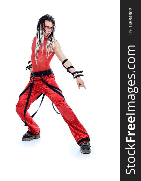 Trendy young man with dreadlocks is dancing. Shot in a studio. Trendy young man with dreadlocks is dancing. Shot in a studio.