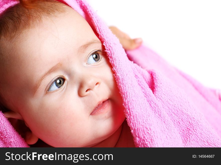 Little baby under pink towel