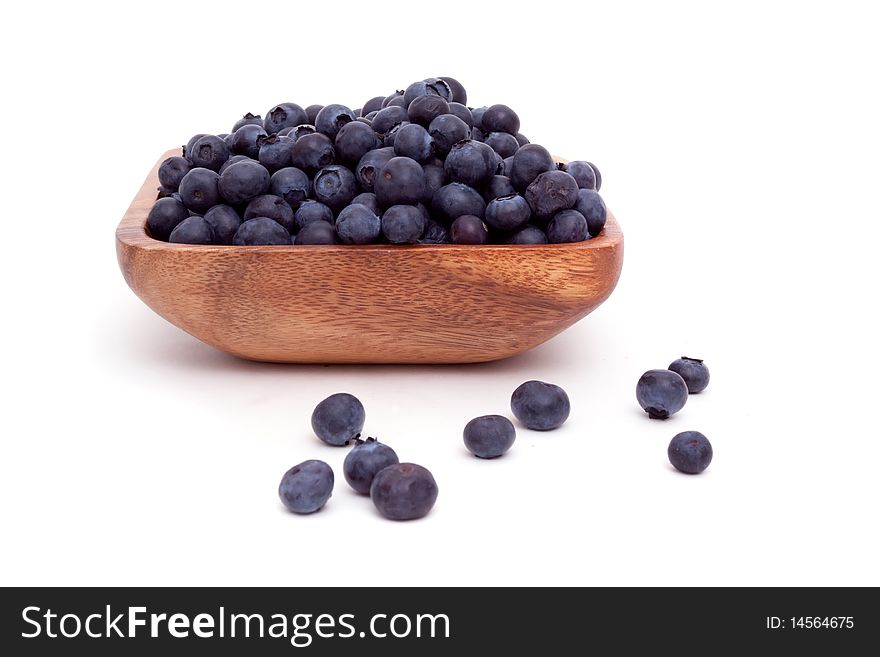 Bowl of blueberries on white background
