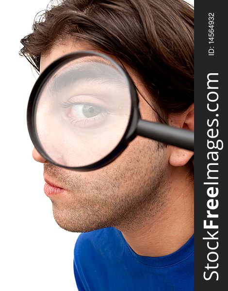 Curious man holding a magnifying glass