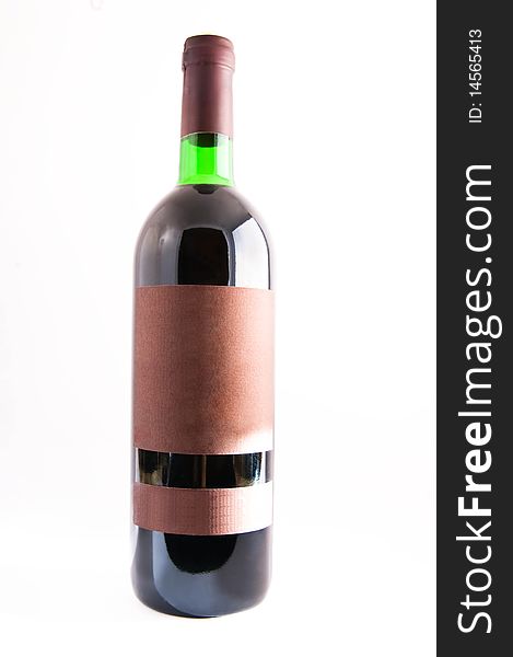 A bottle of red wine with a blank label, isolated on white. A bottle of red wine with a blank label, isolated on white.