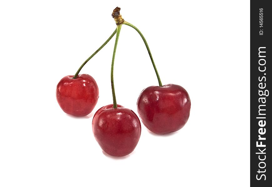 Three cherries on a white background. Three cherries on a white background