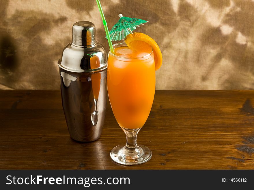 Photo of Orange cocktail on wood table