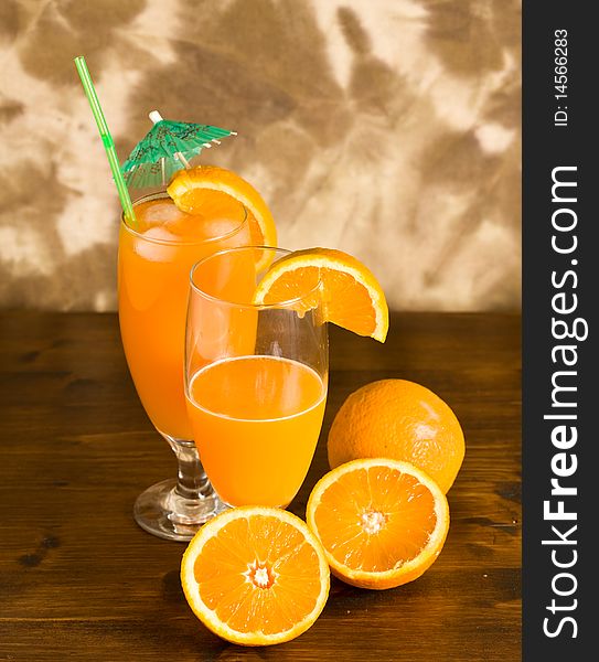 Photo of Orange cocktail on wood table