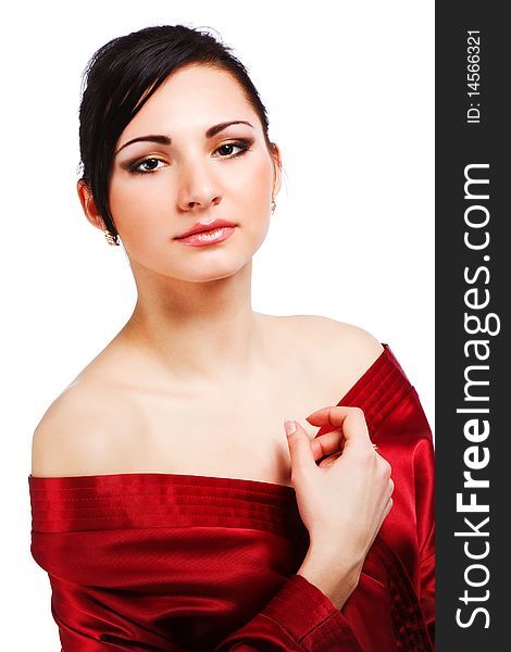 Picture of sensuality young woman in red gown on white background.