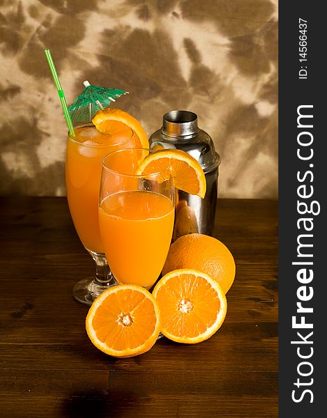 Photo of Orange cocktail on wood table