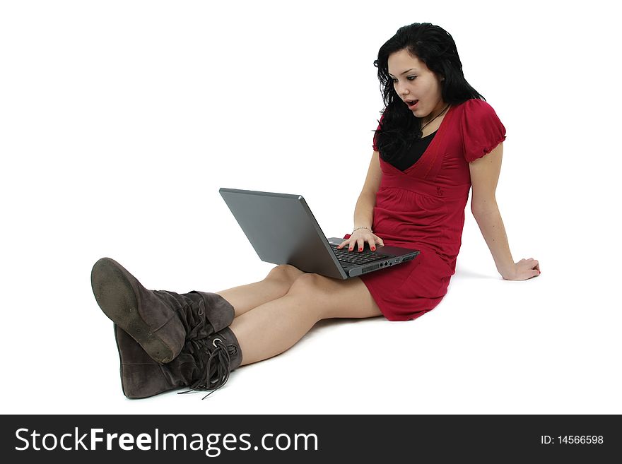 Happy young girl with laptop computer isolated