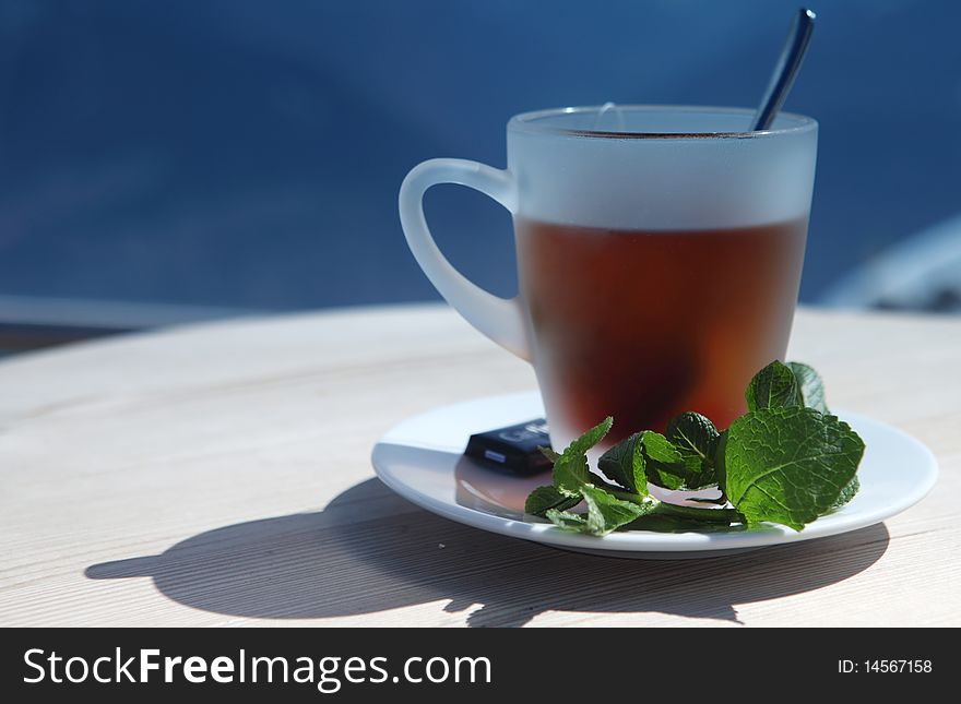 Calefacient Hot Teacup in Restaurant in Alps. Calefacient Hot Teacup in Restaurant in Alps