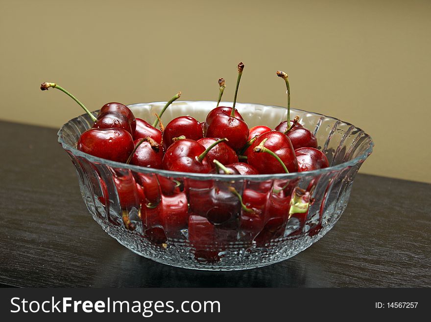 A bowl of fresh cherries on a nice setting. A bowl of fresh cherries on a nice setting.