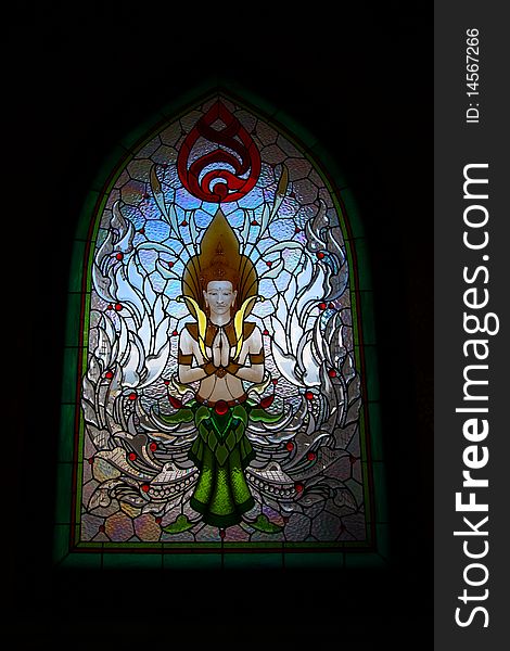 Colorful glass window with Thai art at Mae Slaong sacred sanctuary. Colorful glass window with Thai art at Mae Slaong sacred sanctuary