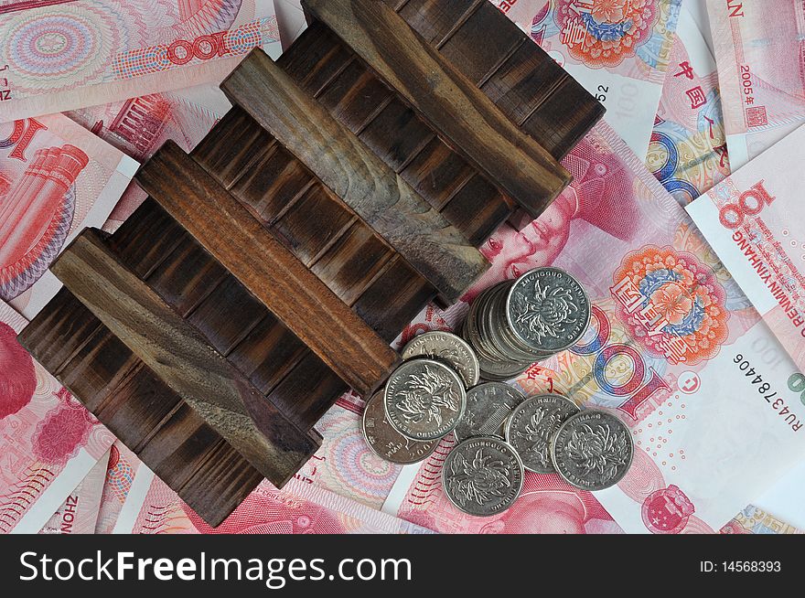 Aged or old wooden box with coin beside, putting on money notes, means money keeping, saving, money protection collection. Aged or old wooden box with coin beside, putting on money notes, means money keeping, saving, money protection collection.