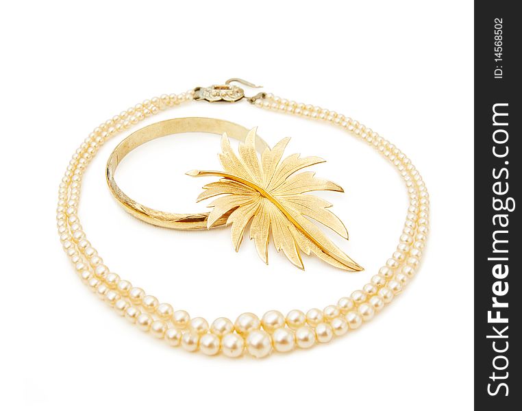 Vintage jewellery - pearls and gold leaf brooch. Isolated on white background. This image is exclusive to Dreamstime. Vintage jewellery - pearls and gold leaf brooch. Isolated on white background. This image is exclusive to Dreamstime.