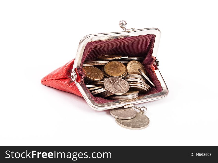 Old red purse against with coins