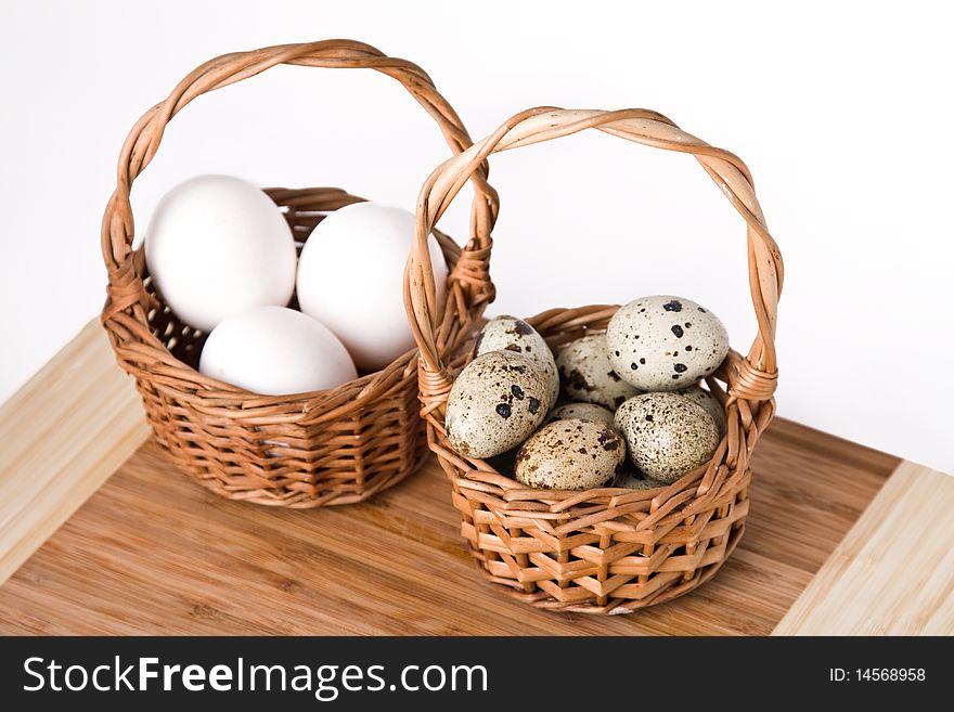 Eggs in basket isolated on a white background