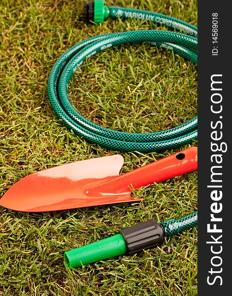 Gardening concept in grass, tools and other equipment