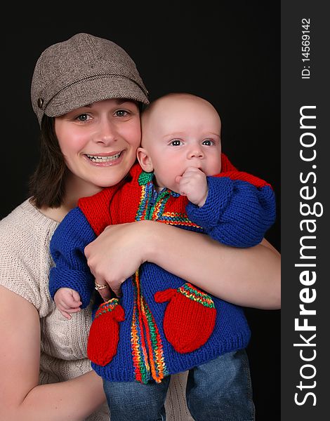 Beautiful mother and baby on a black background