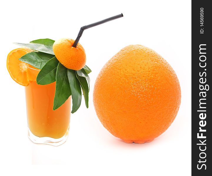 A glass of orange juice and a large orange isolated on a white background. A glass of orange juice and a large orange isolated on a white background