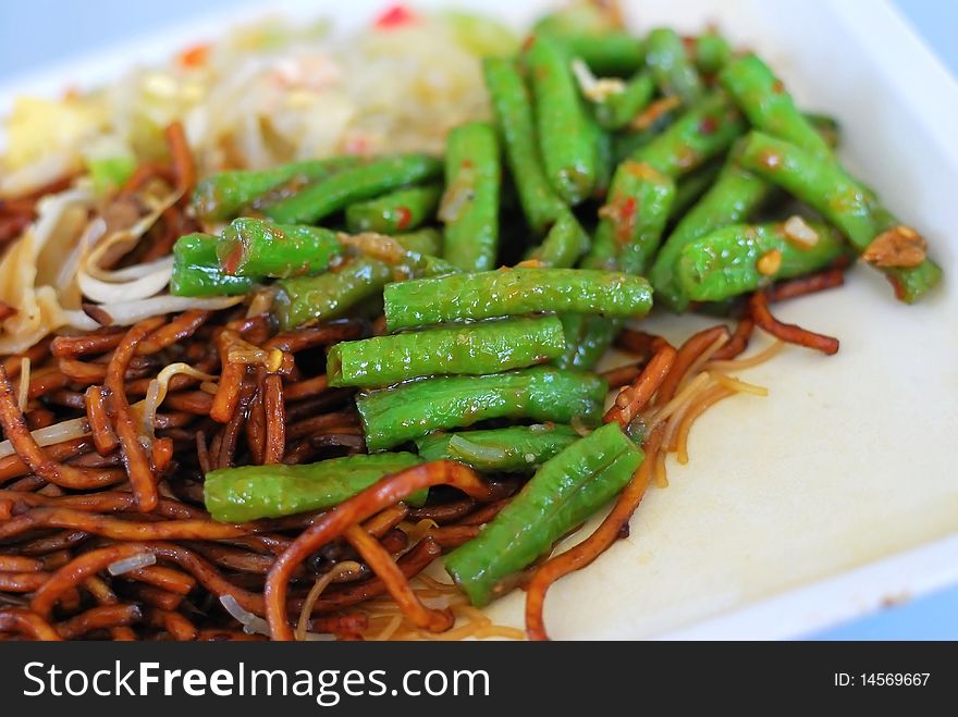 Asian noodles and vegetables. Suitable for concepts such as diet and nutrition, healthy lifestyle, and food and beverage.