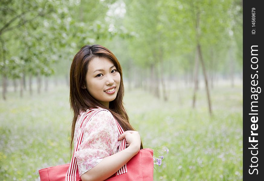 Young woman carrying shopping bag. Young woman carrying shopping bag