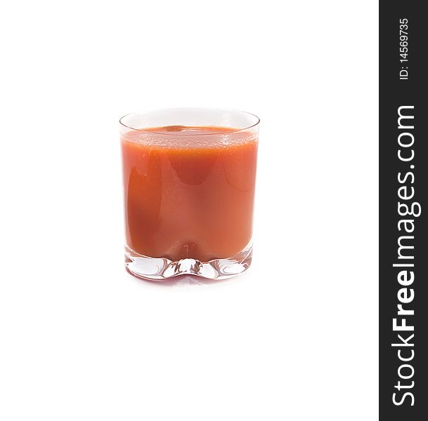 Glass of tomato juice is isolated on a white background