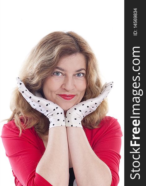 Portrait of a middle-aged woman in red with polka-dot gloves - isolated on white. Portrait of a middle-aged woman in red with polka-dot gloves - isolated on white