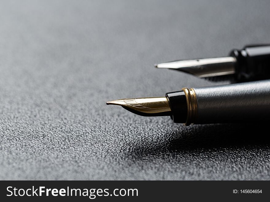Two classics Fountain pen with clipping path on black background